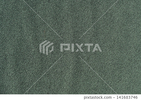 Plain texture background of dark green weed control sheet with a gentle wave pattern. Plain texture background of dark green weed control sheet with a gentle wave pattern. 141683746