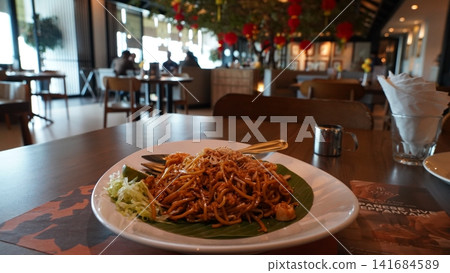 Delicious Noodle Dish Served on Banana Leaf at Restaurant 141684589