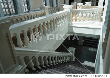 Elegant White Balustrade and Grand Staircase Interior Elegant White Balustrade and Grand Staircase Interior 141685461