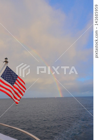 The American flag and rainbow seen from a ship The American flag and rainbow seen from a ship 141685959