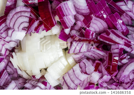 Closeup chopped red and white onion layers culinary texture background Closeup chopped red and white onion layers culinary texture background 141686358