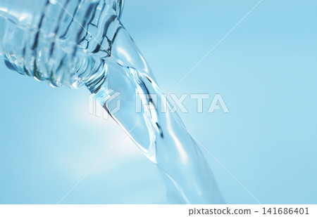 Pour in mineral water from a glass bottle. Pour in mineral water from a glass bottle. 141686401
