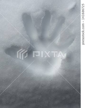 Handprints on the snow Handprints on the snow 141686725