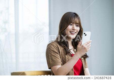 Young woman, smartphone, smiling, search Young woman, smartphone, smiling, search 141687428