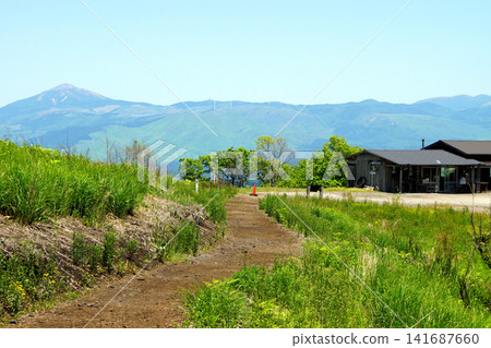 Oshitoishi Hill in Aso, Kumamoto Prefecture: A landscape of green grasslands and megalithic ruins of ancient sites. Oshitoishi Hill in Aso, Kumamoto Prefecture: A landscape of green grasslands and megalithic ruins of ancient sites. 141687660
