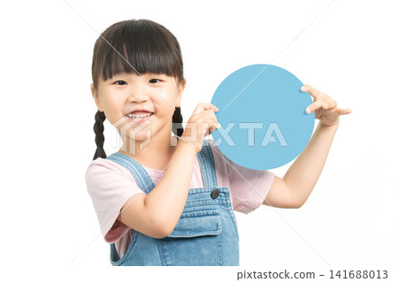 Cheerful girl holding empty blue circular board for text mockup Cheerful girl holding empty blue circular board for text mockup 141688013
