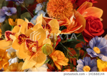 artificial flower of yellow cymbidium orchids and red rose artificial flower of yellow cymbidium orchids and red rose 141688144