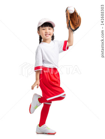 Full length view of a young baseball player raising her gloved hand against a white backdrop. Full length view of a young baseball player raising her gloved hand against a white backdrop. 141688303