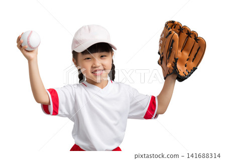 Cheerful little girl celebrating with hands up holding a baseball and a glove on white background. 141688314