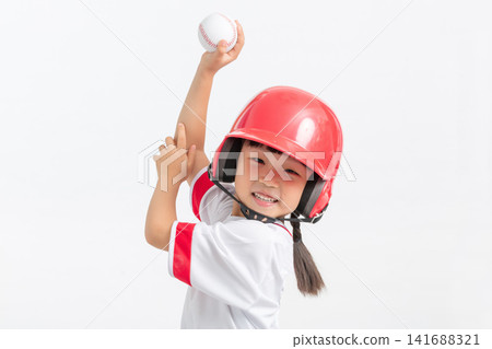 Happy young baseball player while holding a ball in studio. Happy young baseball player while holding a ball in studio. 141688321