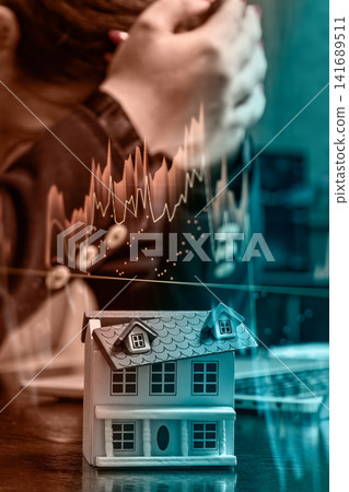 Real estate market crash and mortgage default. Double exposure of dropping property value graphs and a stressed homeowner. Real estate market crash and mortgage default. Double exposure of dropping property value graphs and a stressed homeowner. 141689511