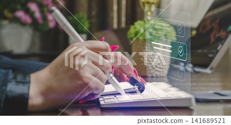 Digital task management and productivity concept. Businesswoman completing virtual checklist with glowing stylus pen. Digital task management and productivity concept. Businesswoman completing virtual checklist with glowing stylus pen. 141689521