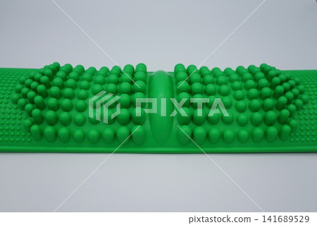 Close-up of a bamboo foot massager Close-up of a bamboo foot massager 141689529