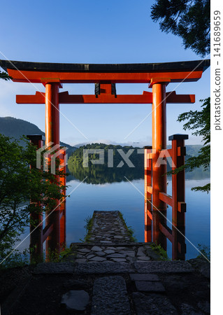 Lake Ashi in the early morning, shrouded in mist; the Torii gate of Peace Lake Ashi in the early morning, shrouded in mist; the Torii gate of Peace 141689659