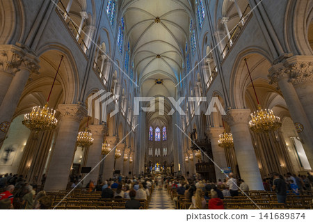 Interior and stained glass windows of Notre Dame Cathedral in Paris, France Interior and stained glass windows of Notre Dame Cathedral in Paris, France 141689874