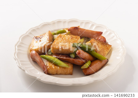 Deep-fried tofu, sausages, and asparagus stir-fried in butter. Deep-fried tofu, sausages, and asparagus stir-fried in butter. 141690233