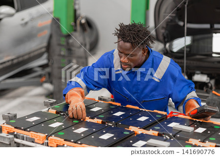 Professional EV Car Service, Male worker Electricity Vehicle Fix Maintenance EV Car Battery Professional EV Car Service, Male worker Electricity Vehicle Fix Maintenance EV Car Battery 141690776