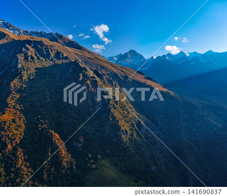 Majestic Mountain Landscape with Sunbeams in Kyrgyzstan 141690837