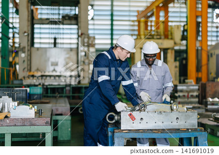 Engineer worker team service injection mold, Professional men work in die casting plant mold service Engineer worker team service injection mold, Professional men work in die casting plant mold service 141691019