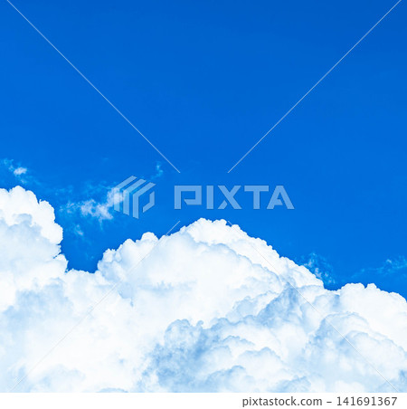 A simple image of a blue sky and towering cumulonimbus clouds rising silently in the middle of summer. A simple image of a blue sky and towering cumulonimbus clouds rising silently in the middle of summer. 141691367