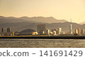 The cityscape of Fukuoka, illuminated at dusk, and the PayPay Dome and Fukuoka Tower. 141691429