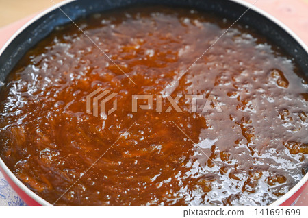 Homemade rhubarb jam made in a frying pan Homemade rhubarb jam made in a frying pan 141691699