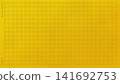 An elegant gold leaf background featuring a raised relief of the traditional "houndstooth" pattern. 141692753