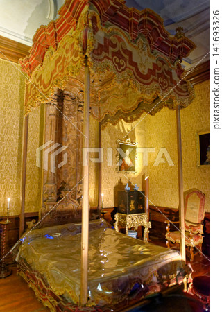 The historic Baroque state bedchamber with silk damask walls and lacquered cabinet at Dyrham Park, England The historic Baroque state bedchamber with silk damask walls and lacquered cabinet at Dyrham Park, England 141693326