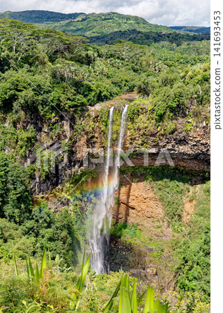 Chamarel Waterfall Dropping into a Lush Forested Gorge in Mauritius Chamarel Waterfall Dropping into a Lush Forested Gorge in Mauritius 141693453