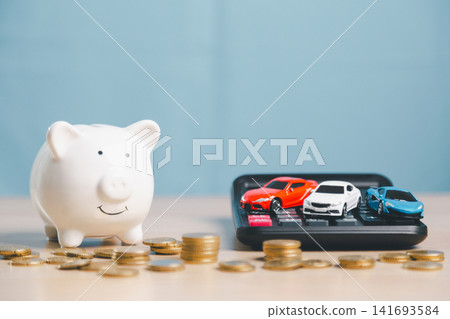 Piggy bank with toy cars on calculator and scattered coins, representing car savings, auto loan comparison, vehicle finance planning, insurance cost, and purchase budget. Piggy bank with toy cars on calculator and scattered coins, representing car savings, auto loan comparison, vehicle finance planning, insurance cost, and purchase budget. 141693584