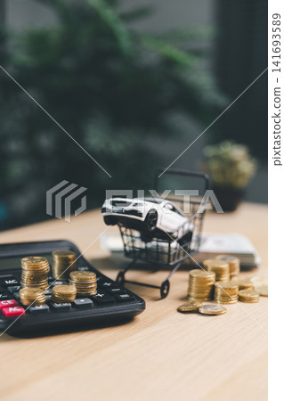 White toy car in mini shopping cart with calculator, money, and coin stacks, symbolizing car purchase decision, auto finance, and vehicle cost planning. White toy car in mini shopping cart with calculator, money, and coin stacks, symbolizing car purchase decision, auto finance, and vehicle cost planning. 141693589