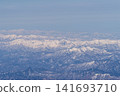 Aerial view of snow-covered mountains 141693710