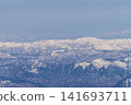 Aerial view of snow-covered mountains 141693711