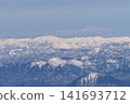 Aerial view of snow-covered mountains 141693712