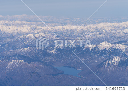 Aerial view of snow-covered mountains Aerial view of snow-covered mountains 141693713