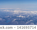 Aerial view of snow-covered mountains 141693714