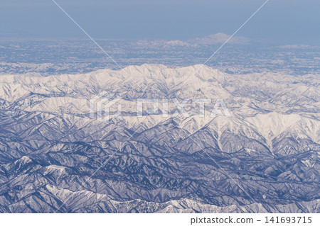 Aerial view of snow-covered mountains Aerial view of snow-covered mountains 141693715