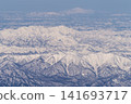 Aerial view of snow-covered mountains 141693717