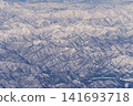 Aerial view of snow-covered mountains 141693718