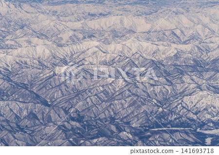 Aerial view of snow-covered mountains Aerial view of snow-covered mountains 141693718