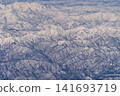 Aerial view of snow-covered mountains 141693719