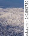 Aerial view of snow-covered mountains 141693720