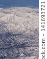 Aerial view of snow-covered mountains 141693721