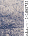 Aerial view of snow-covered mountains 141693722
