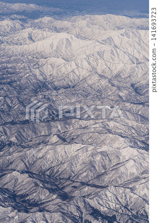 Aerial view of snow-covered mountains Aerial view of snow-covered mountains 141693723