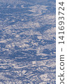 Aerial view of snow-covered mountains 141693724