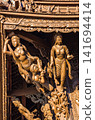 Detailed wood carvings of celestial figures beneath ornate roof at Sanctuary of Truth 141694414
