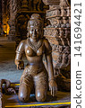 Kneeling wood-carved statue inside Sanctuary of Truth temple interior, Pattaya 141694421