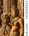Close-up wood carving of celestial figure with ornate scrollwork at Sanctuary of Truth 141694422