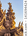 Wide view of multi-faced deity tower crowning Sanctuary of Truth temple, Pattaya 141694424